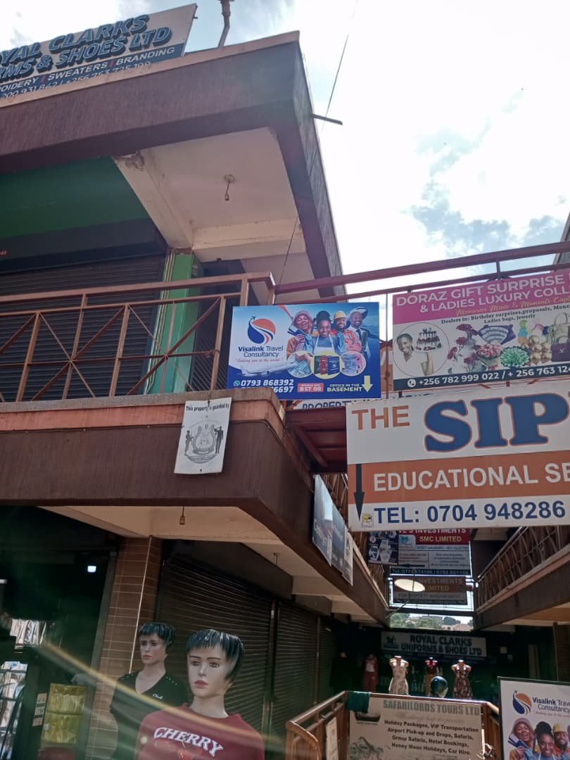 Visa Link Travel Consultancy office signage outside Orange City Building